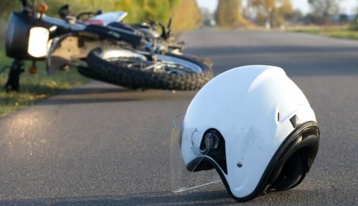 Motorcycle helmet on the road after a traumatic accident