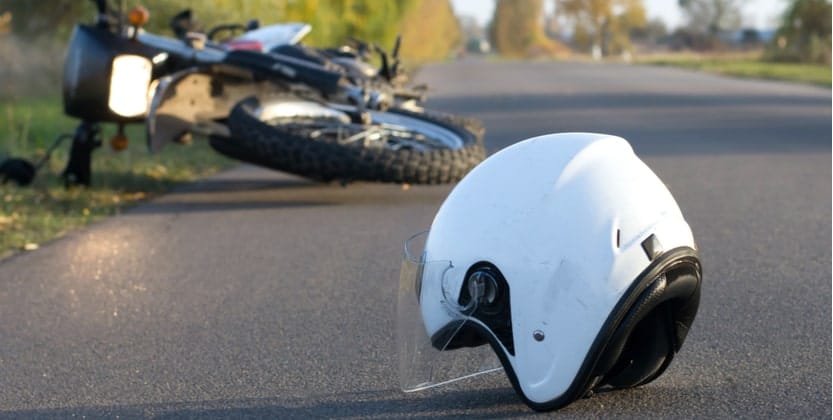 Motorcycle helmet on the road after a traumatic accident