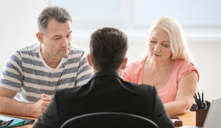 Couple speaking with a personal injury lawyer