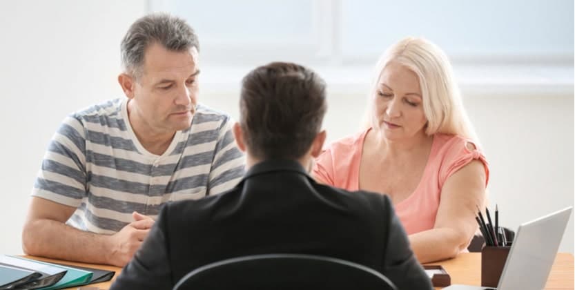 Couple speaking with a personal injury lawyer