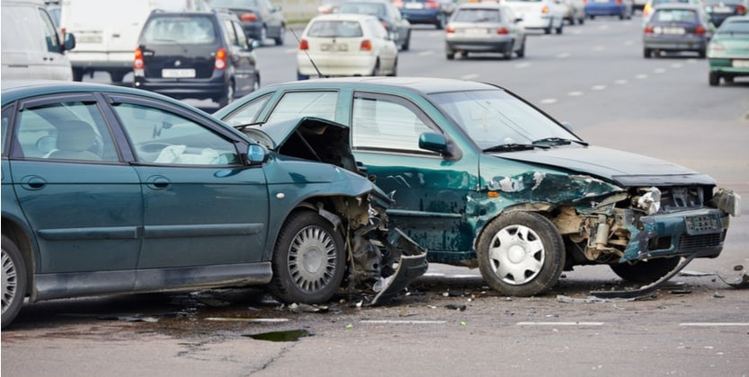 Two small green cars involved in a head-on collision on the highway in Fort Lauderdale