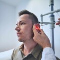 Doctor doing ear examination of young patient