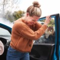 Female Motorist In Crash For Crash Insurance Fraud Getting Out Of Car