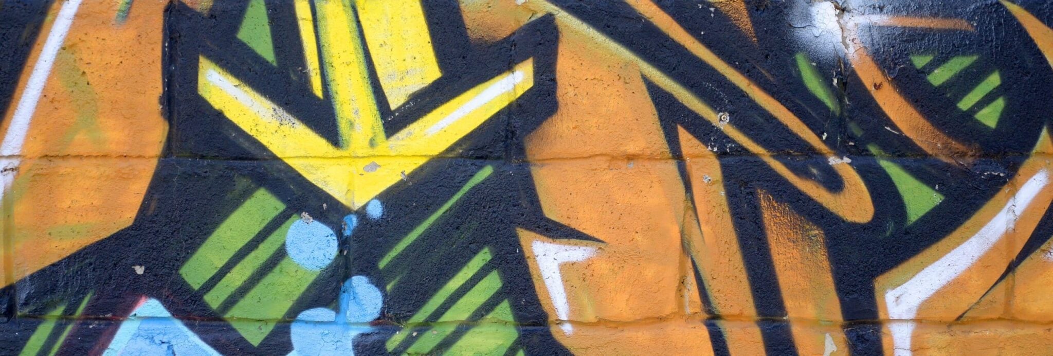 Fragment of colored street art graffiti paintings with contours and shading close up