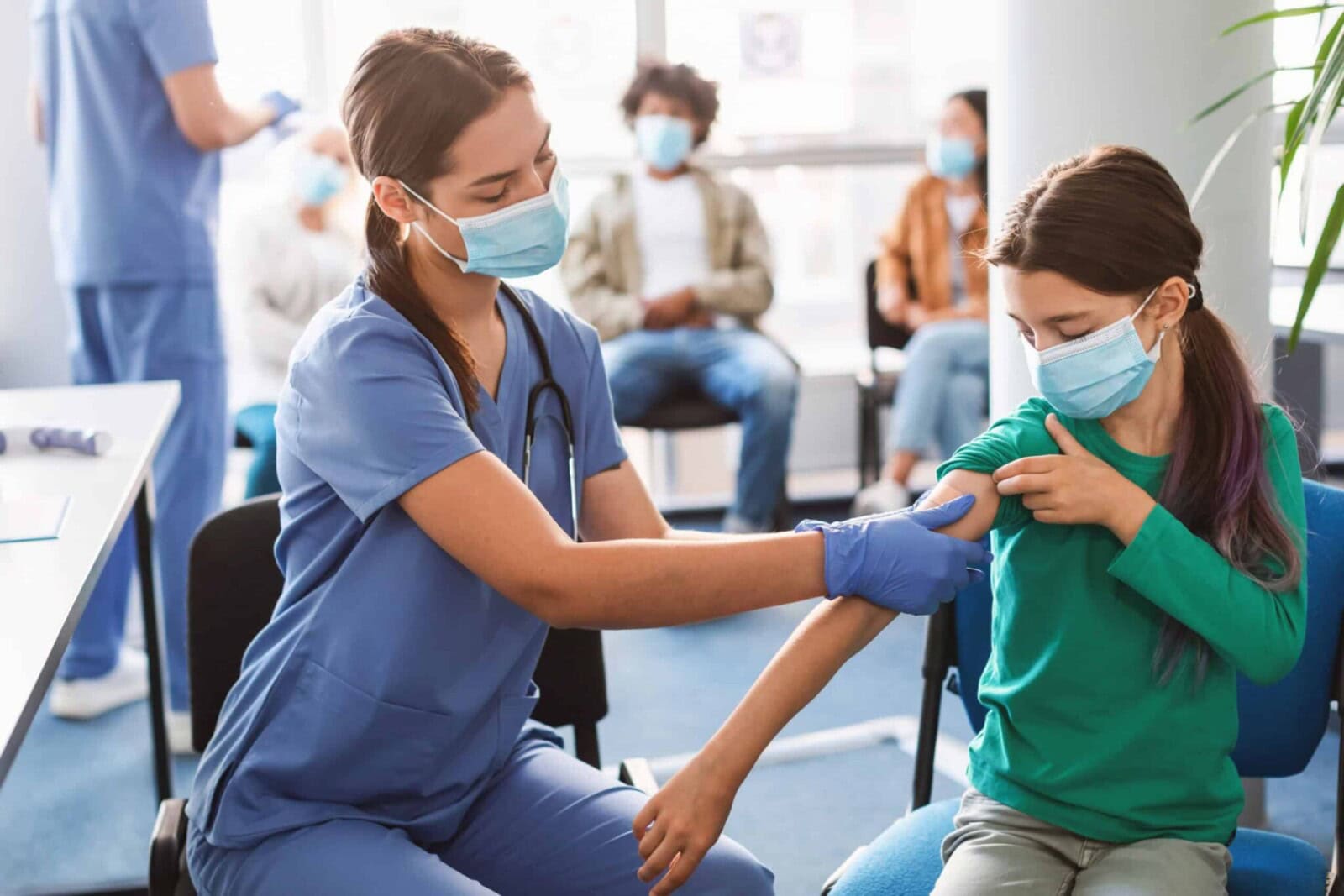 Teen Getting Vaccinated Against Covid, Nurse Applying Adhesive Bandage