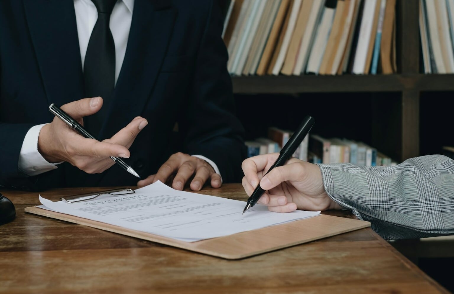 Group of business people and lawyers discussing contract papers ,Consultation between a male lawyer