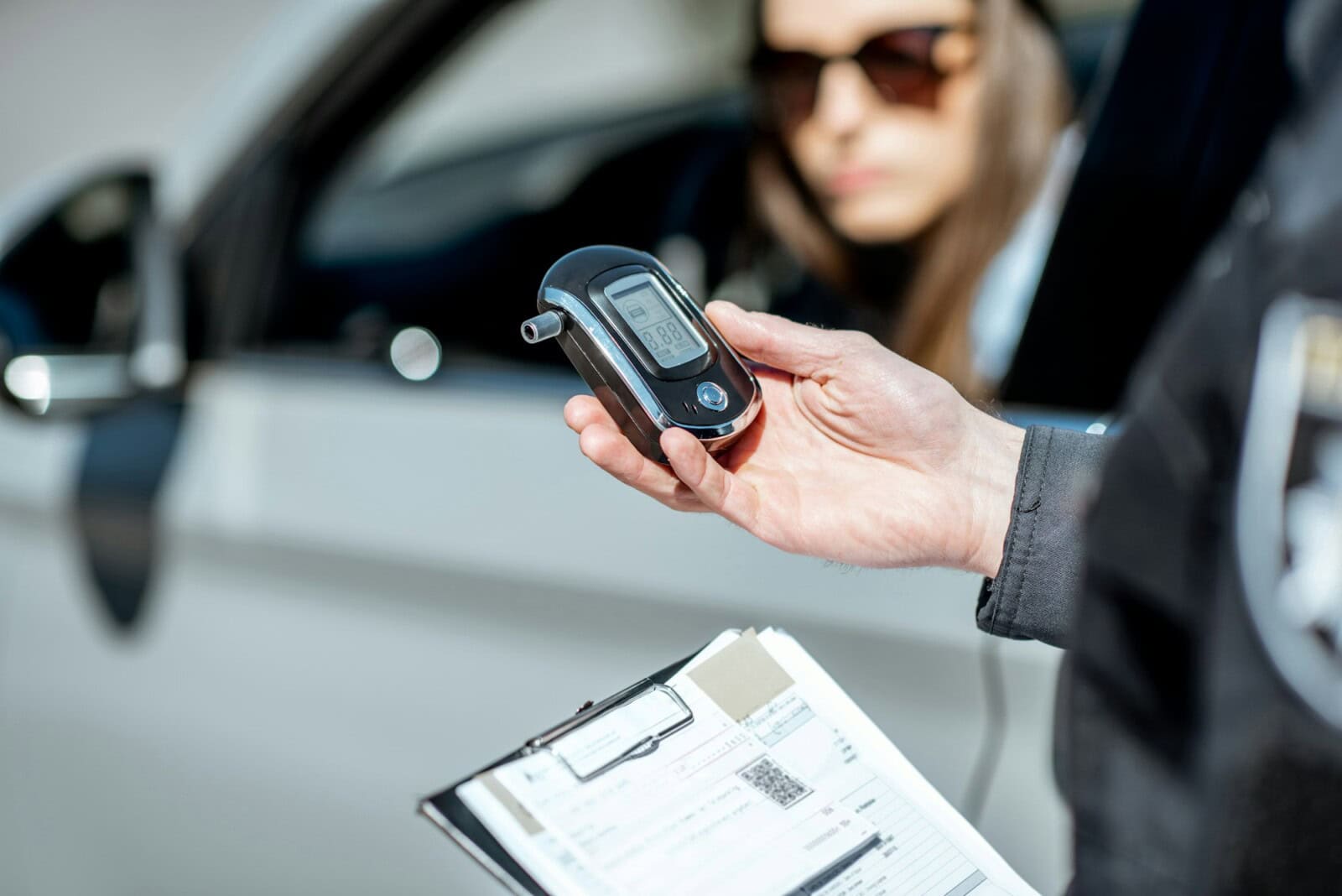 Policeman with alcotest device