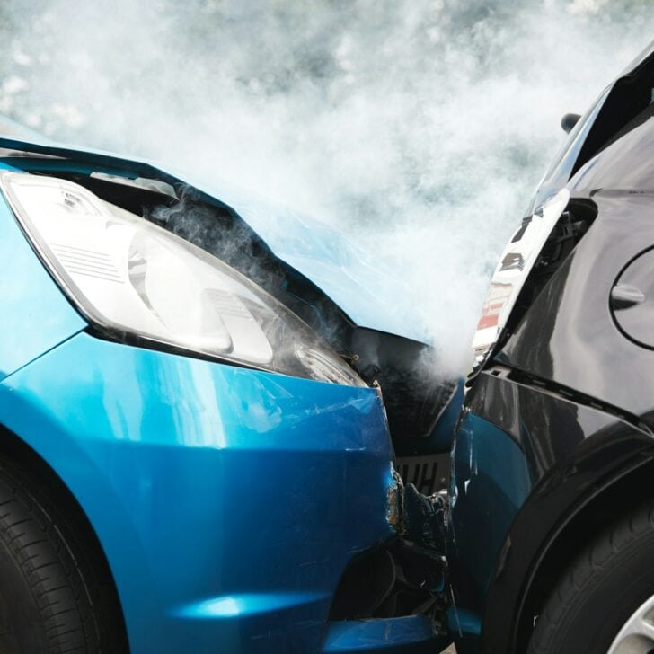 Close Up Of Two Cars Damaged In Road Traffic Accident
