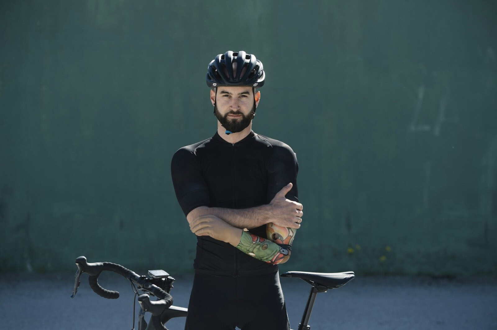 Handicapped cyclist leaning on bike