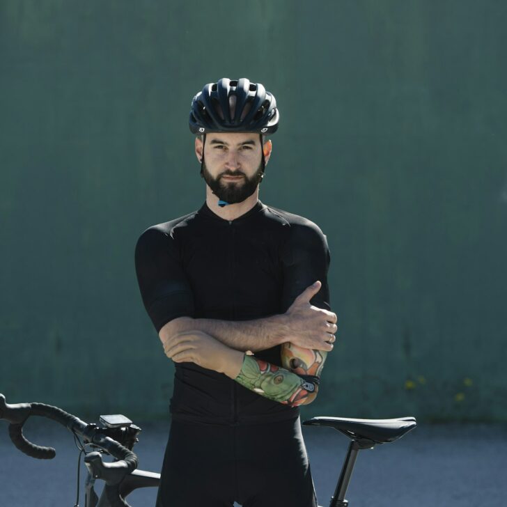 Handicapped cyclist leaning on bike