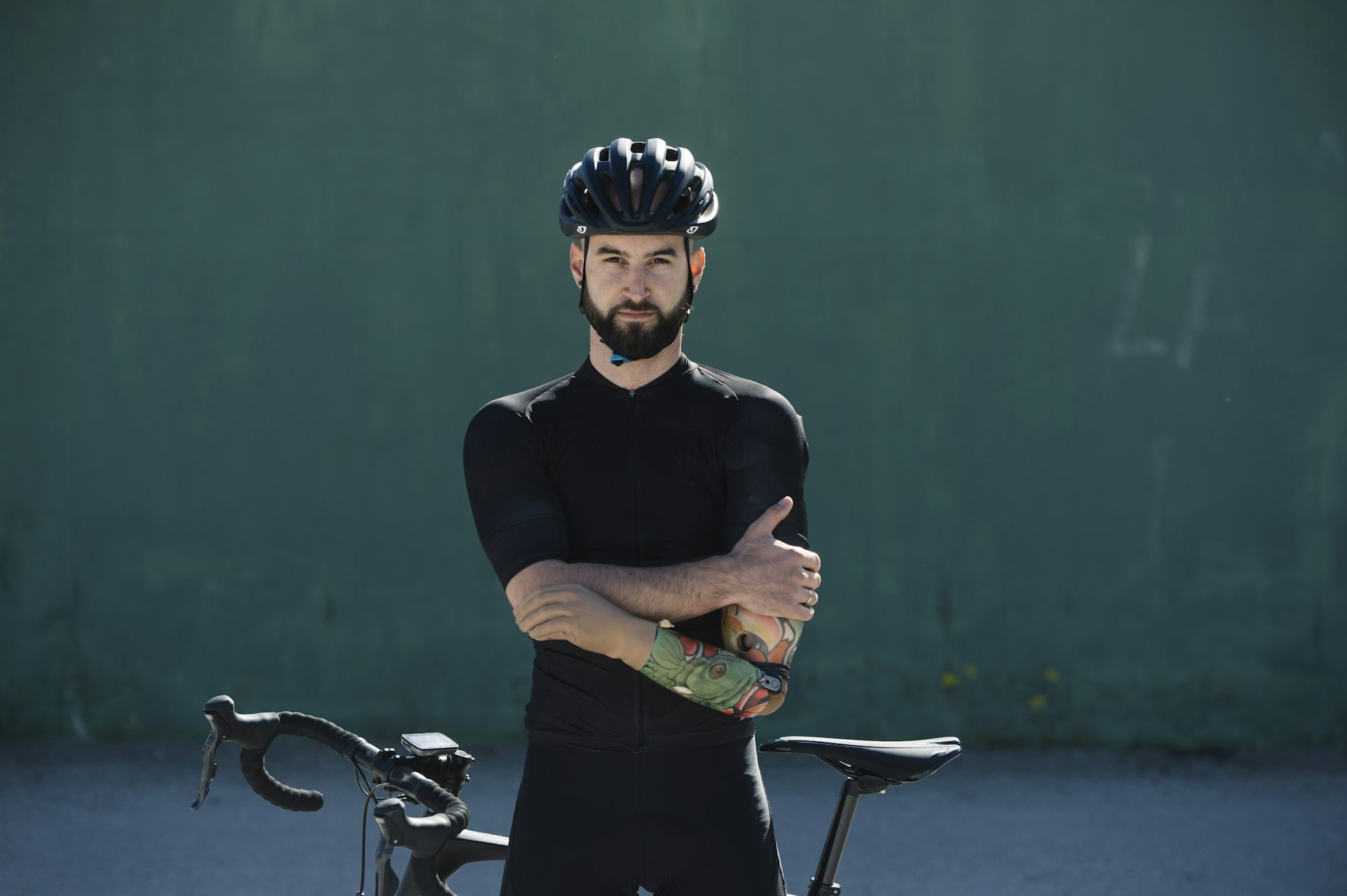 Handicapped cyclist leaning on bike