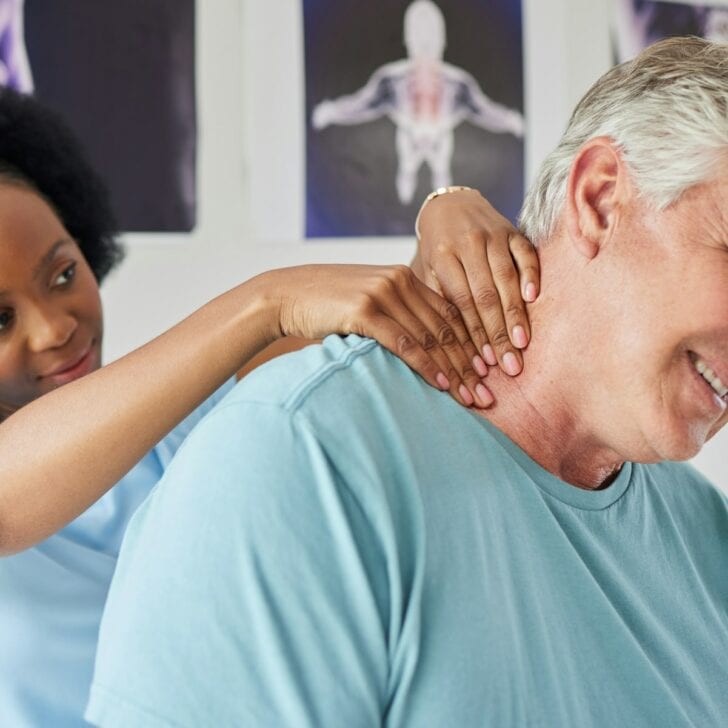 Healthcare, neck pain and a black woman chiropractor with a patient in her office for rehabilitatio