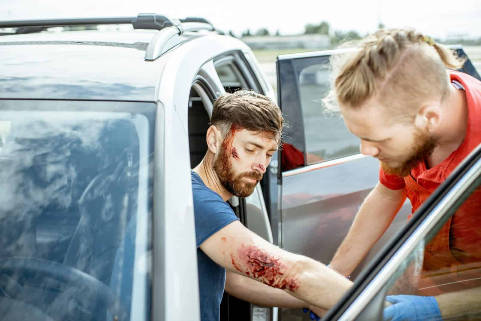 Medic examining victim after the accident