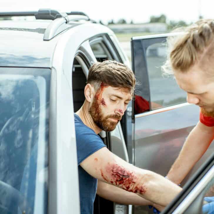Medic examining victim after the accident