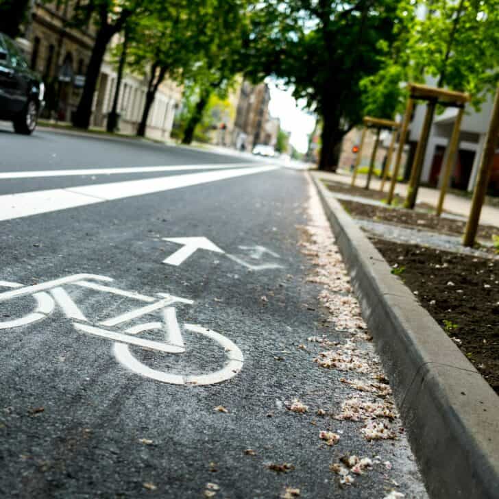 Selective focus of a freshly paint bicycle lane on the side of a street