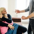 Violence at home aggressive man verbally assault his wife and daughter.