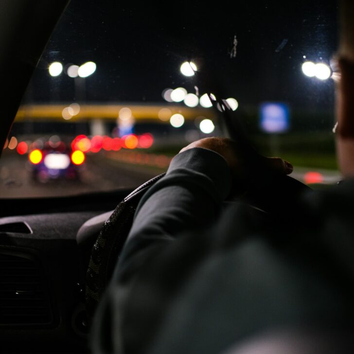 Man driving a car at night