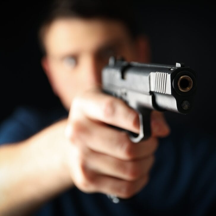 Man hold pistol. Selective focus. Self defense weapon