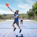 Couple playing pickleball outdoor at daylight