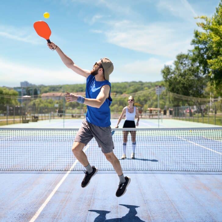 Couple playing pickleball outdoor at daylight