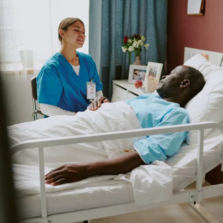 Providing Care to Patient in Hospital Bed