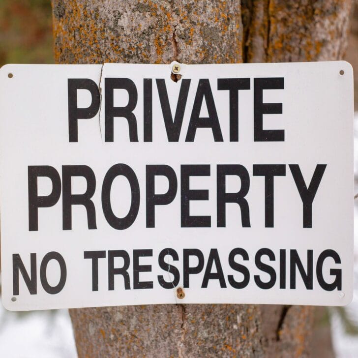 Private property no trespassing sign on a tree