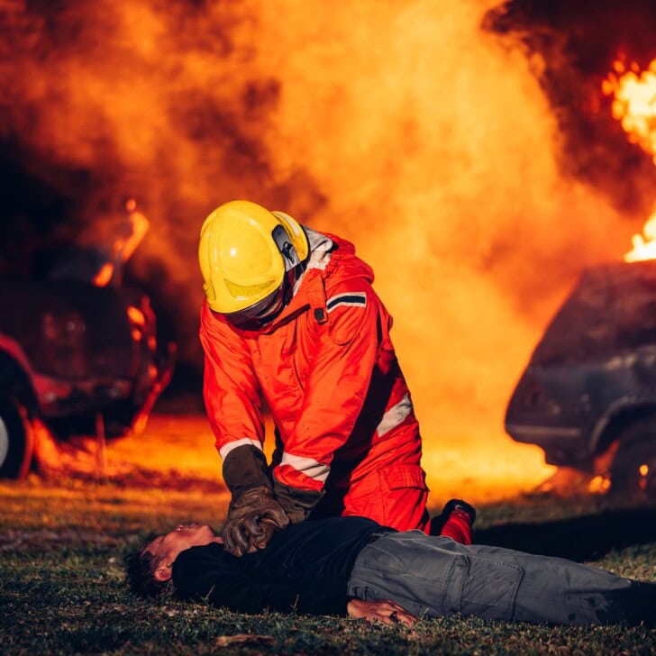 First Aid Support and Courageous Firefighters Saving People from Workplace Accidents. Fearless Firefighter Heroes Rescuing Lives from Smoke and Fire Hazards.